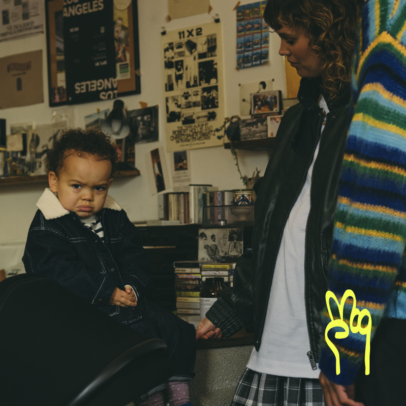 baby looking moody in a record store