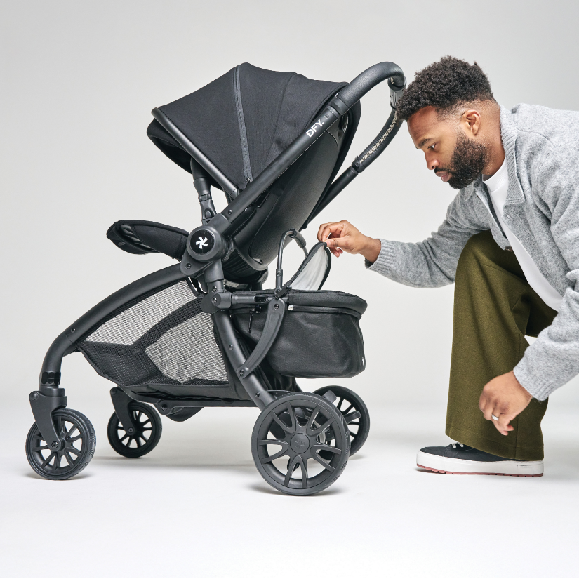 dad looking in cool box attached to stroller