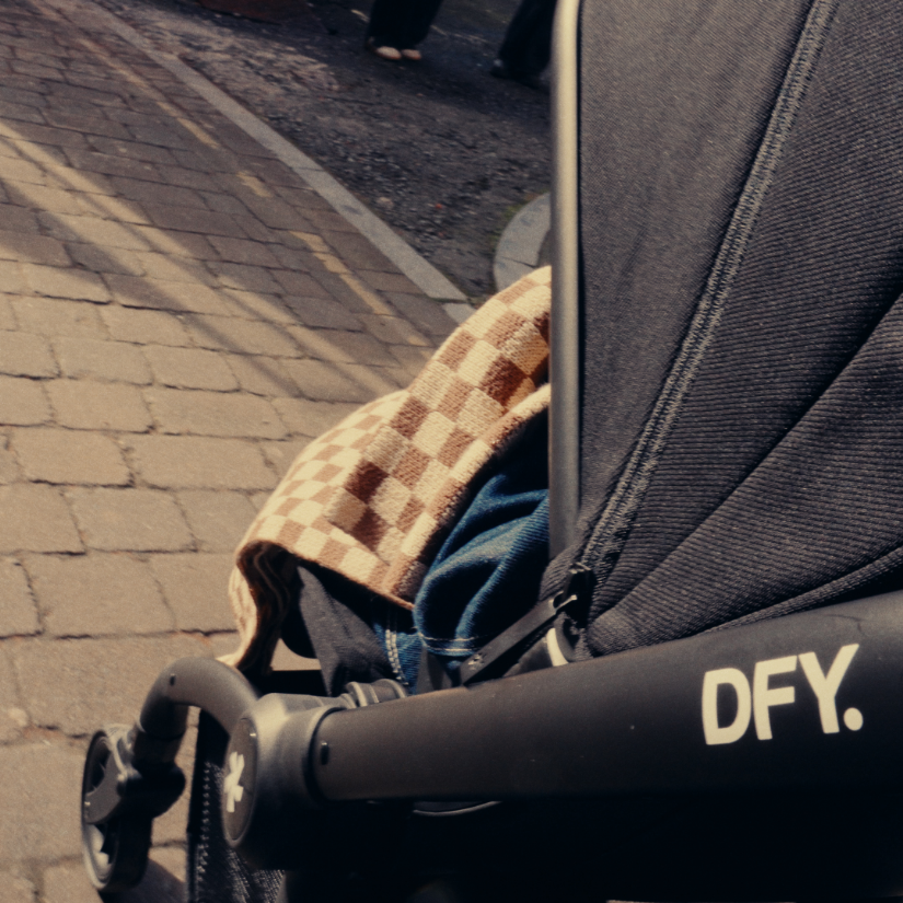 shot of side of stroller with DFY logo on it