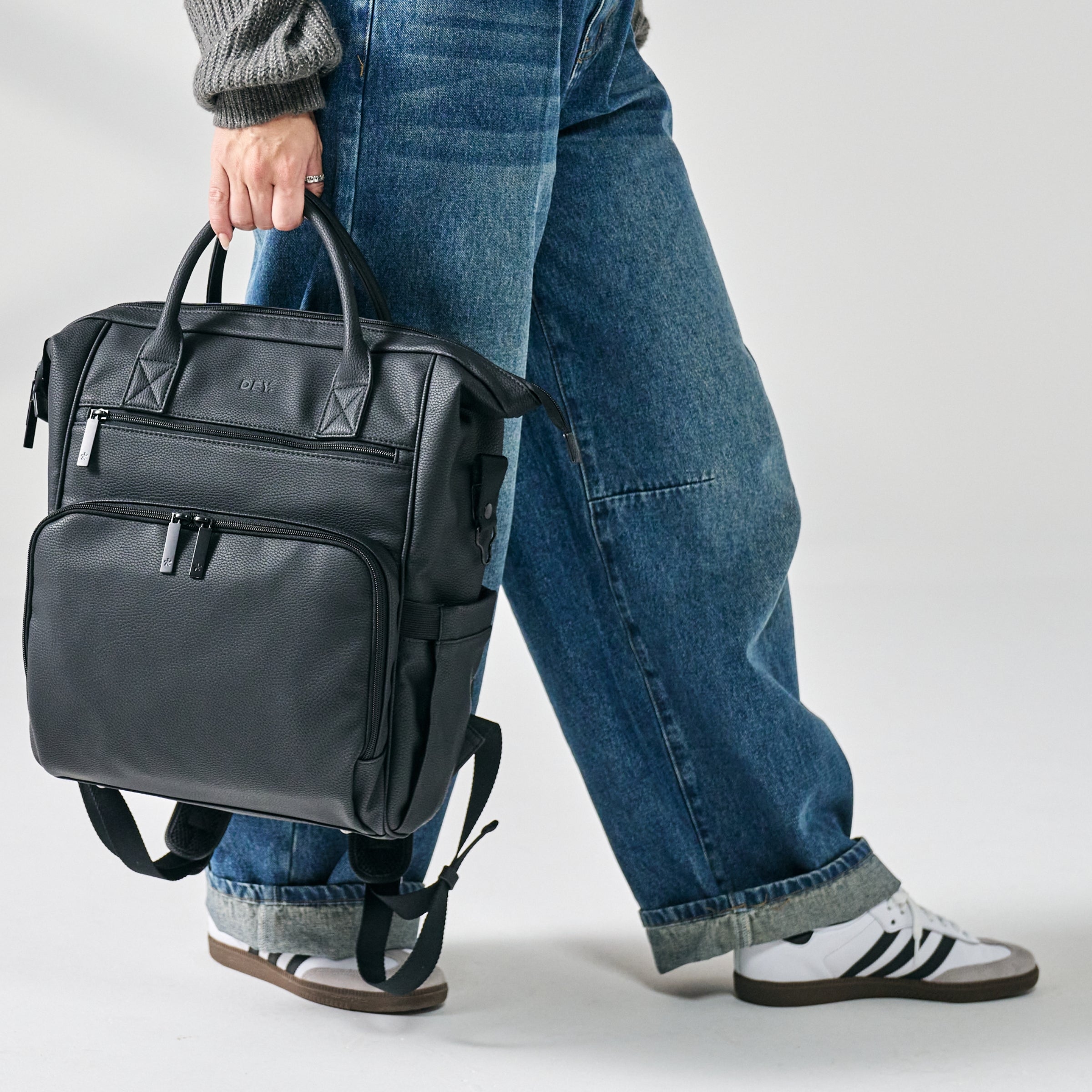 shot of mom holding diaper backpack
