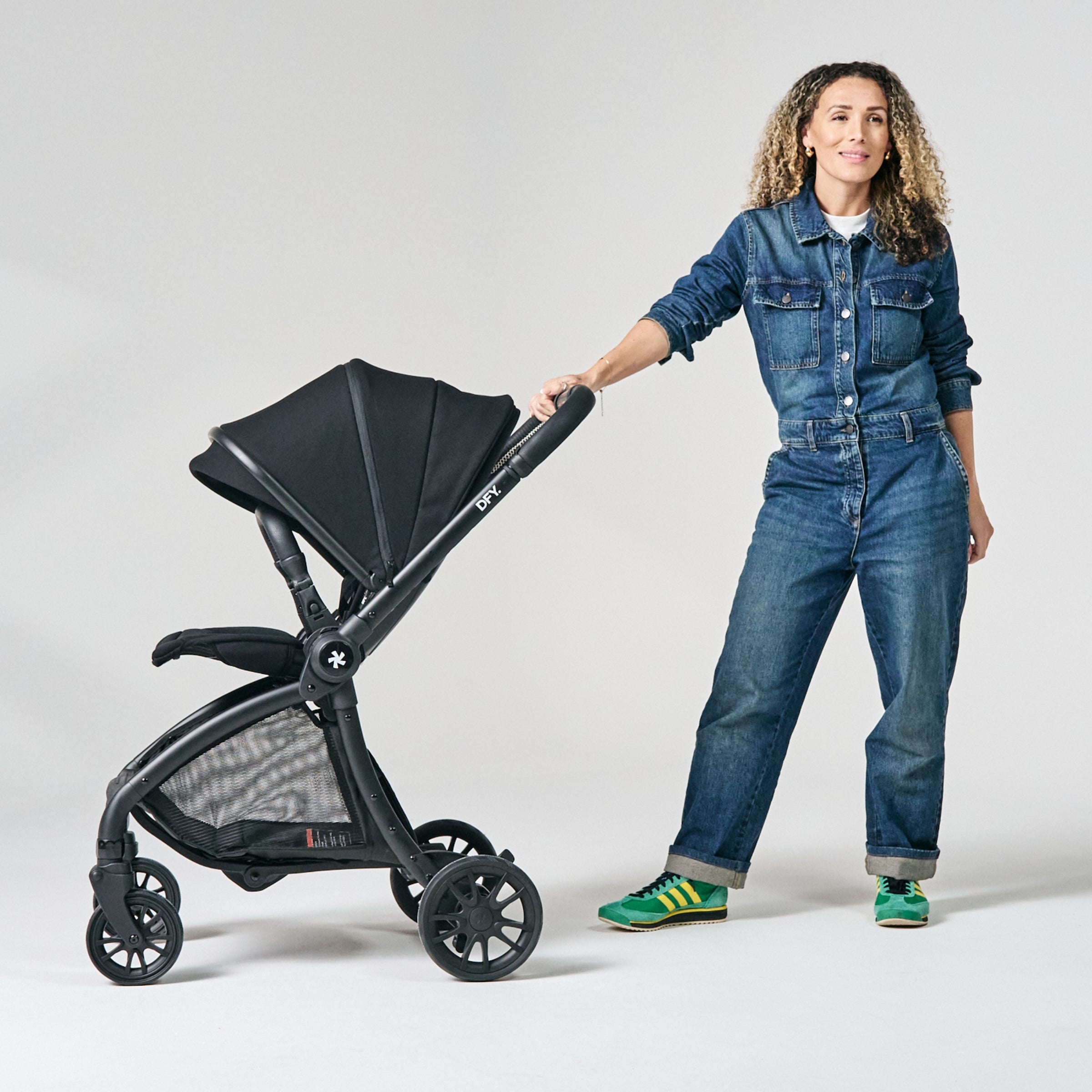 Mom wearing Denim jumpsuit with the R1 Stroller