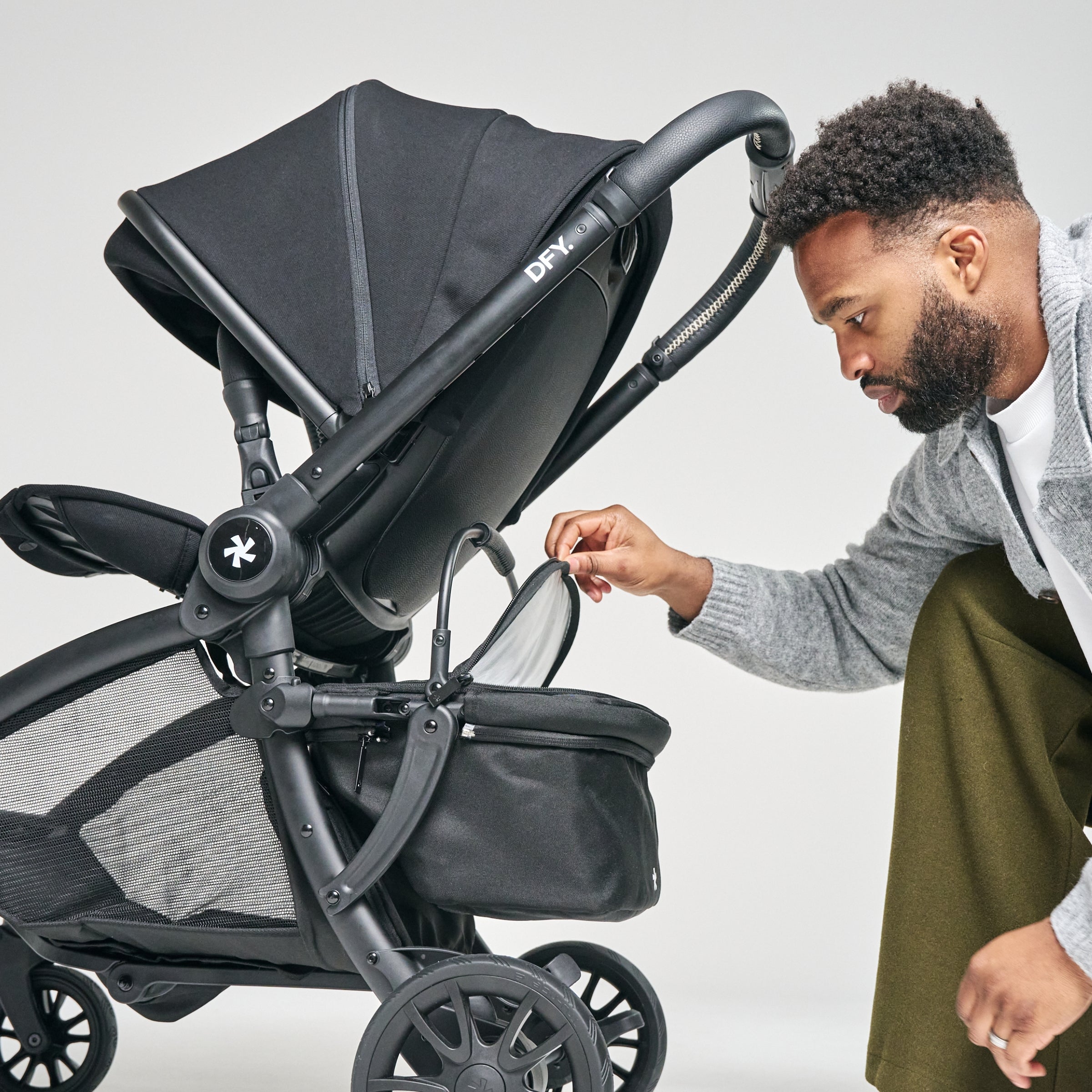 shot of dad looking in cool box attached to stroller