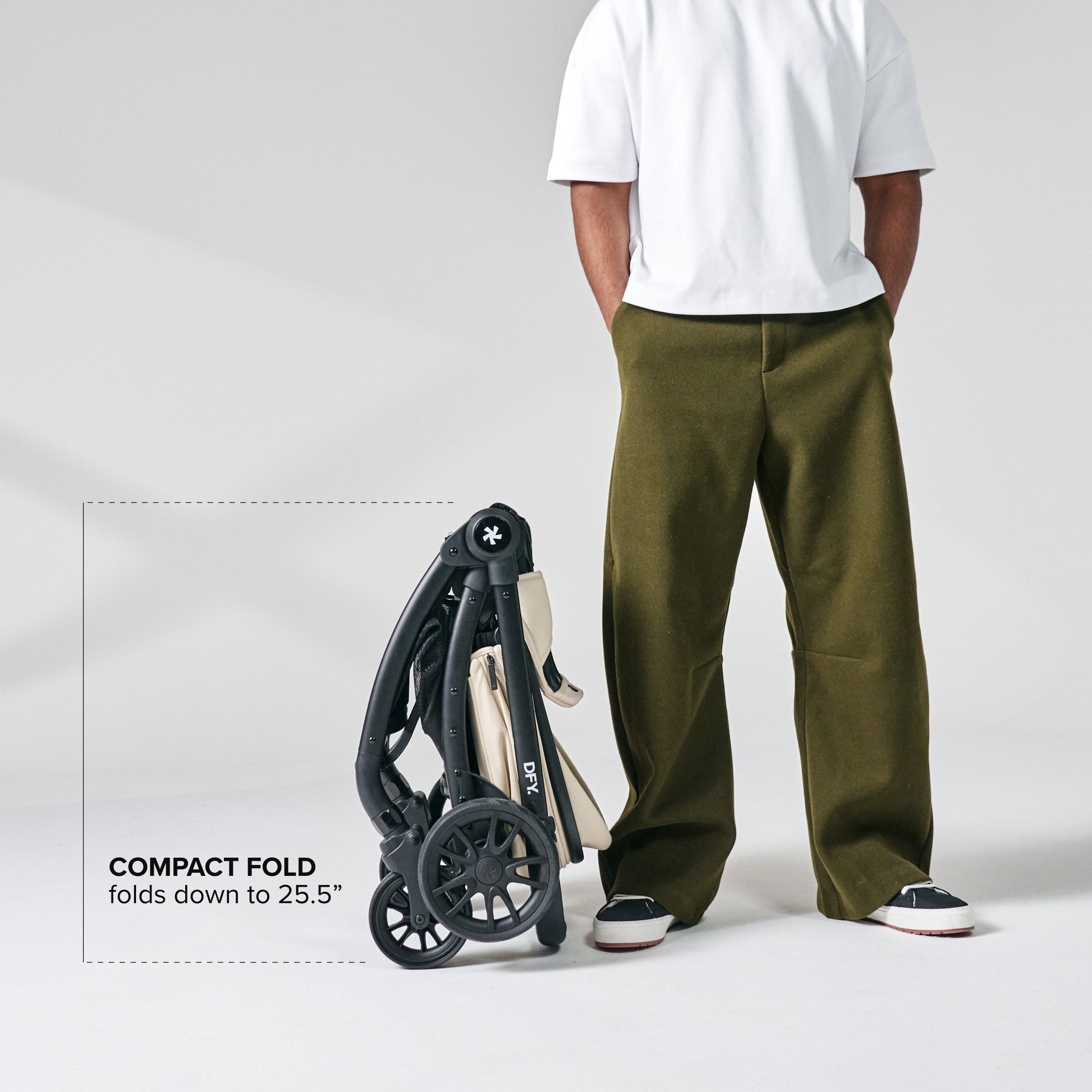 Image of stroller in folded position next to dad