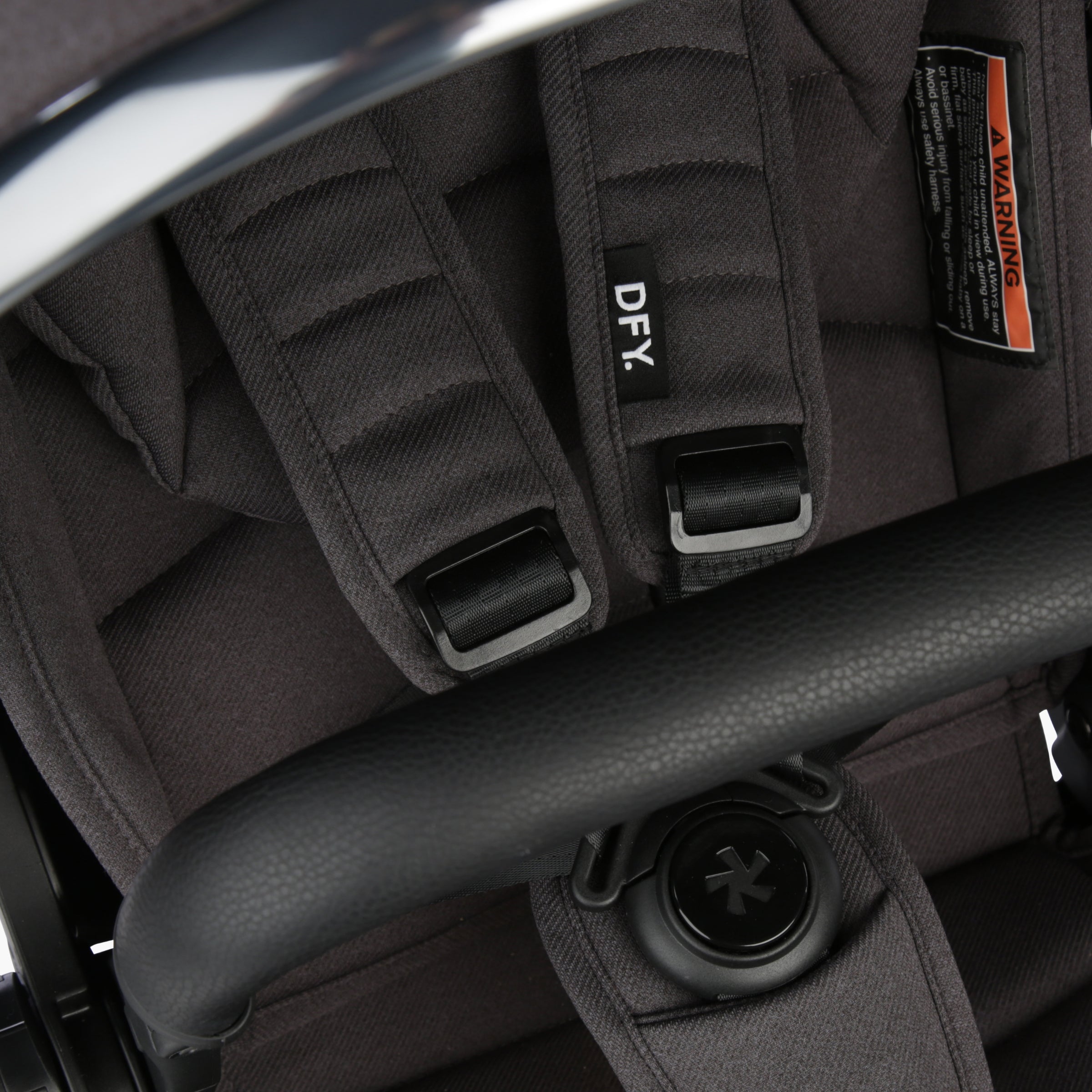 Close up image of the stroller seat and straps