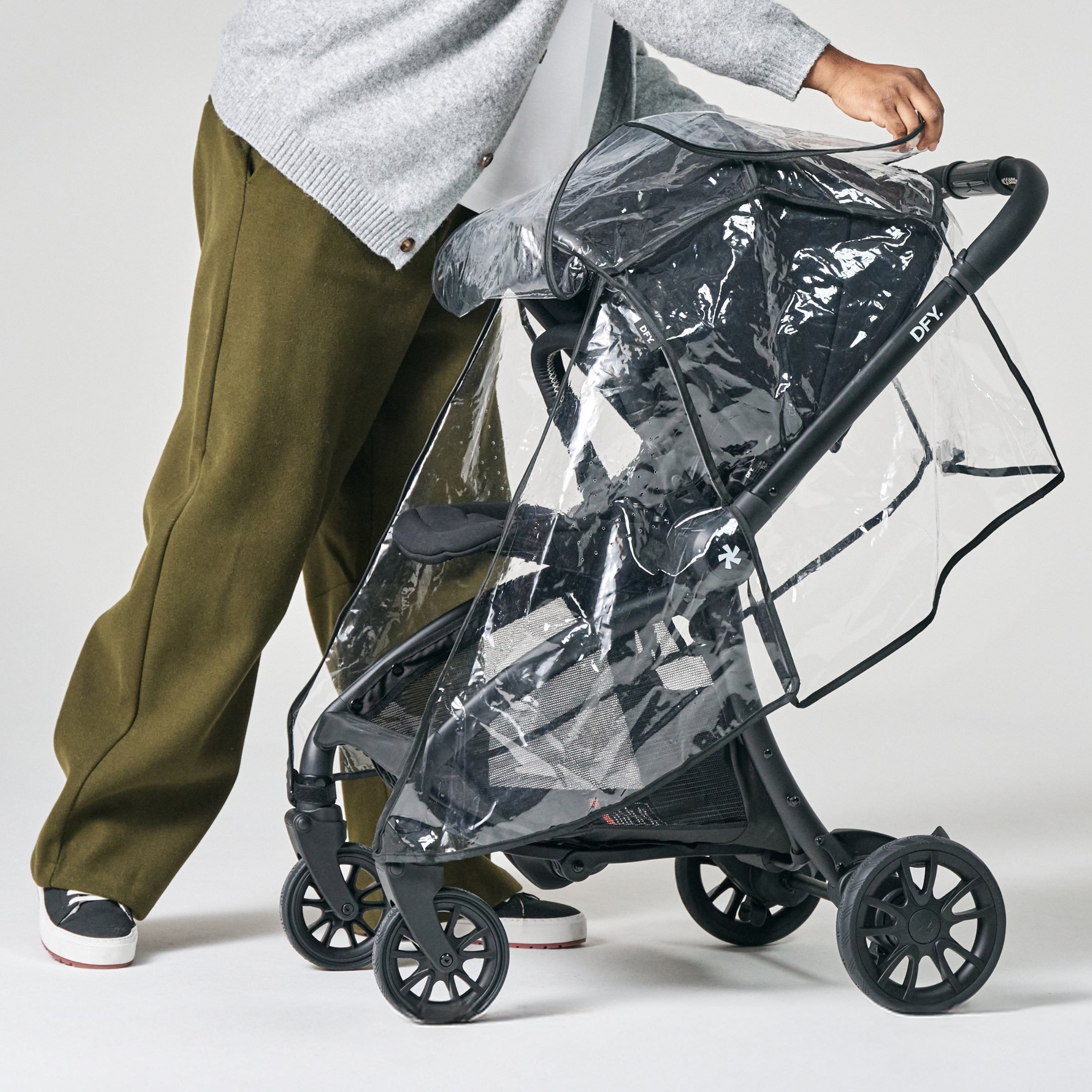 image of dad putting raincover on stroller